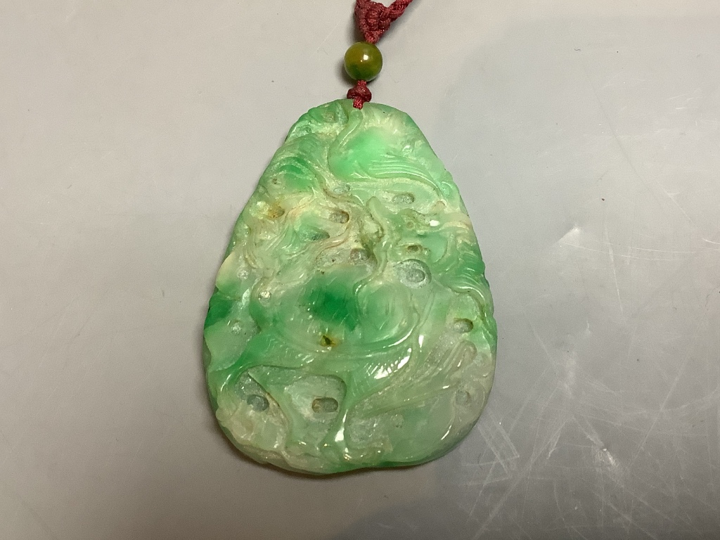 A Chinese jadeite pendant , a pair of bangles, earrings and a cricket pendant